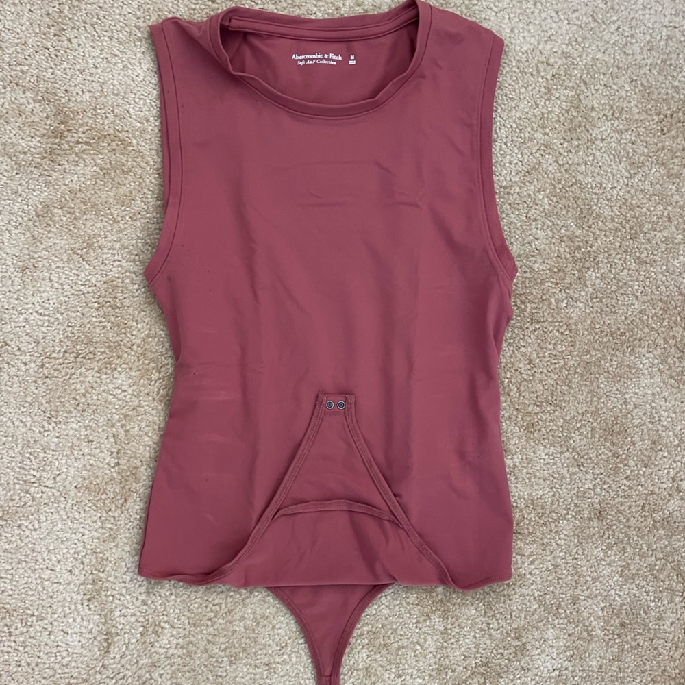 Autumn thong-style bodysuit (piling to the armpit areas commensurate with age)